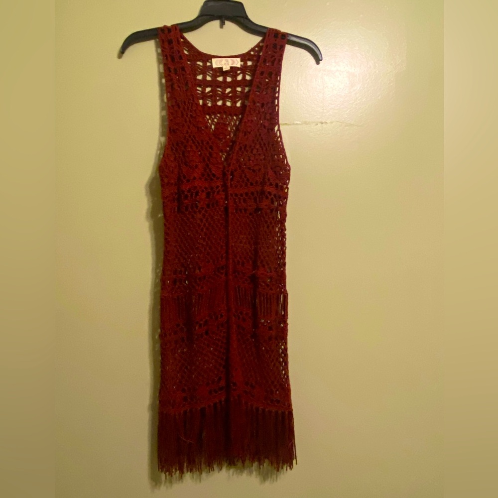 Burgundy color sleeveless knit sweater great over any top with jeans.